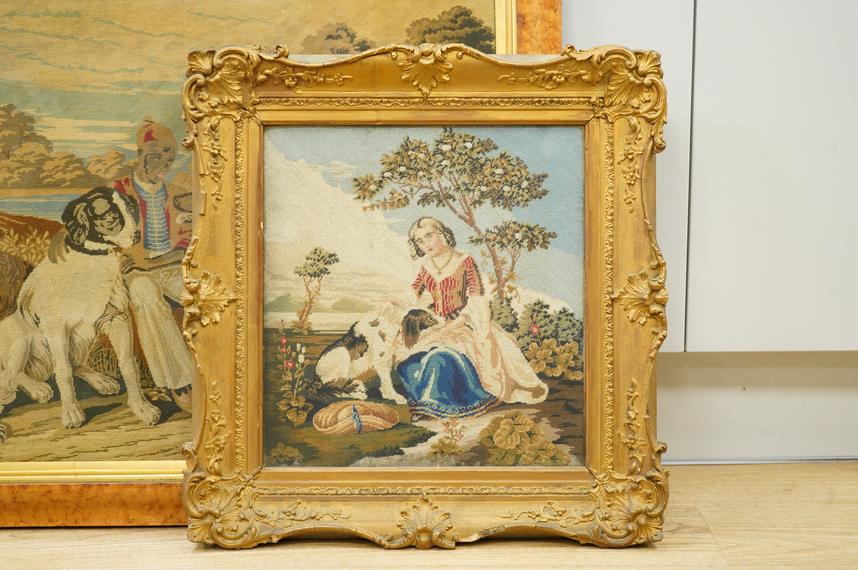 Two Victorian Berlin woolwork tapestry panels, figures seated beside dogs, framed, largest 49 x 65cm